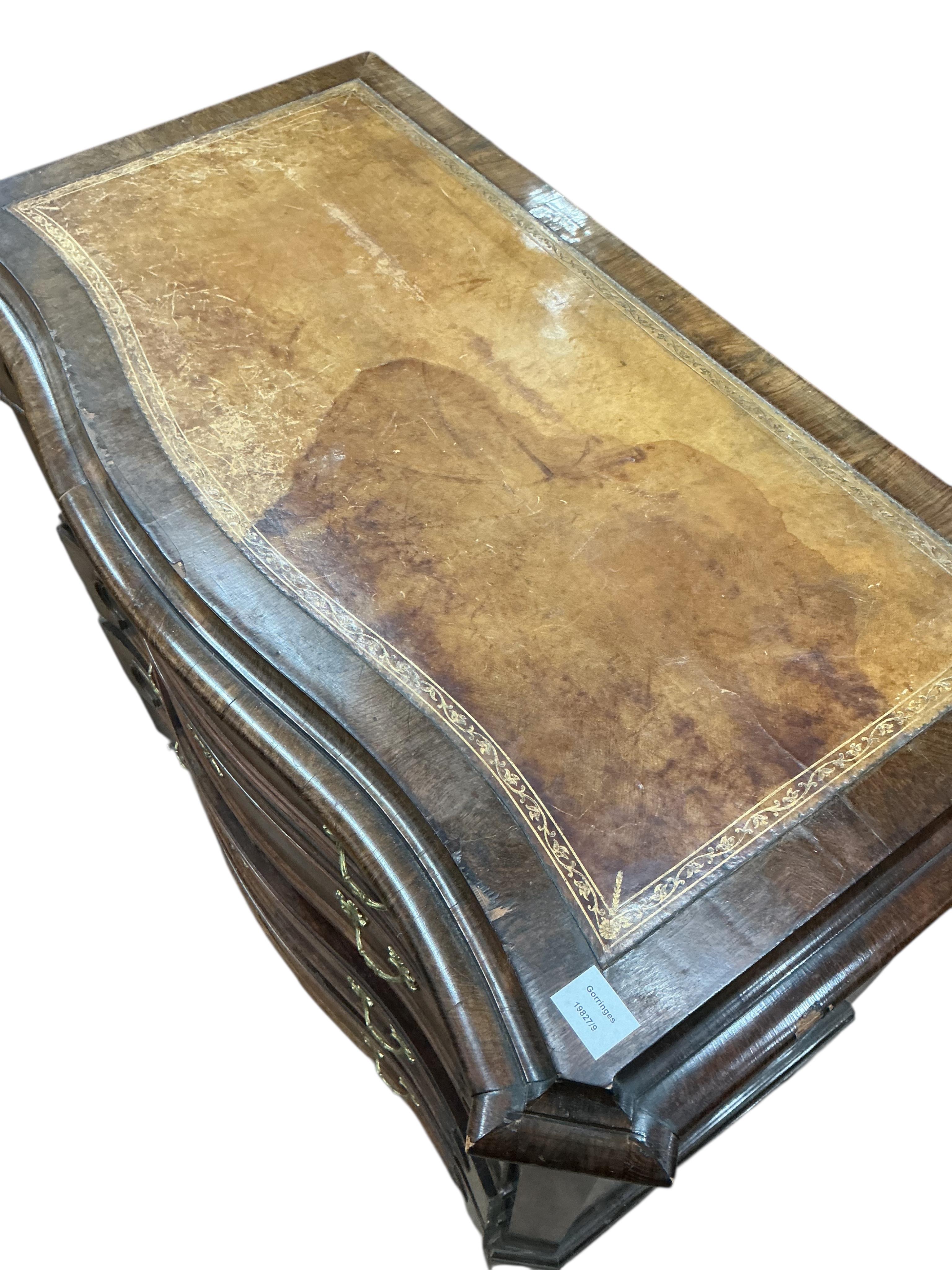A 19th century French rosewood serpentine chest of drawers, with leather inset top, width 112cm, depth 56cm, height 95cm